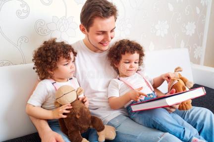 dad-two-daughters-twins-reading-book-couch-room-teaching-children-to-read-happy-family-73671792
